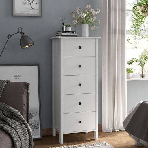 Right angled transitional five-drawer tall tall dresser in a bedroom with accessories