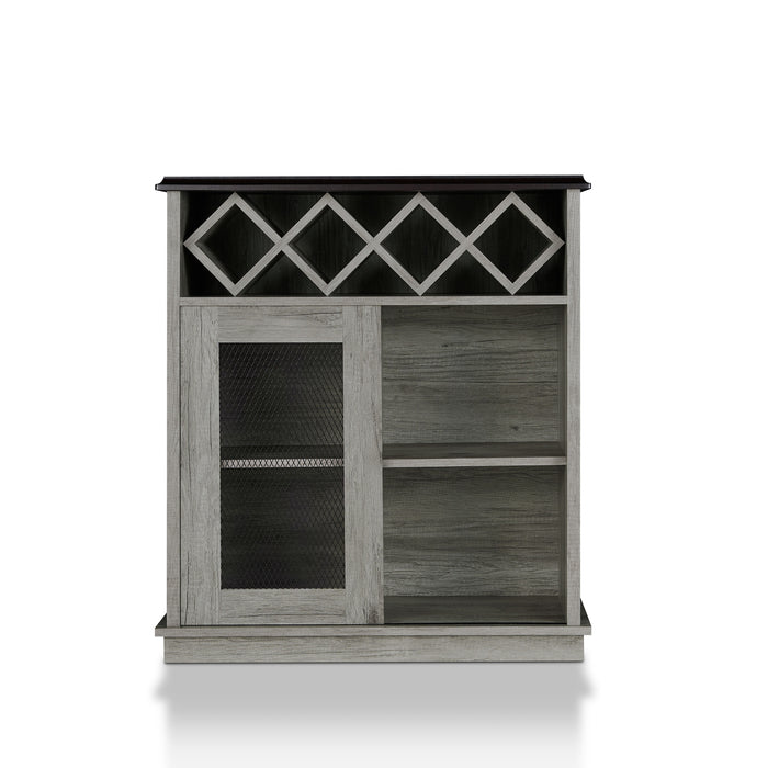 Front-angled vintage grey oak wine buffet against a white background. A 4-slot lattice rack decorates just below the tabletop while an iron-mesh accented cabinet door reveals two shelves left of the open shelves.