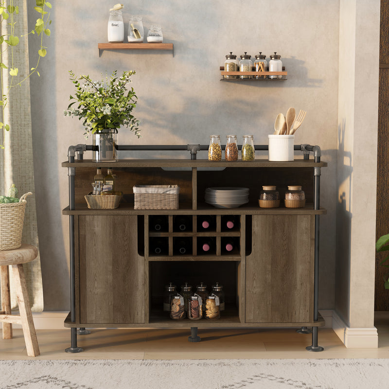 Front-facing reclaimed oak wine cabinet in a contemporary home. The pipe-accented lipped top displays wooden cooking utensils while the open shelves store other kitchen supplies. The wine rack holds 8-bottles.
