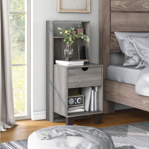 Right-angled transitional vintage gray finish wood one-drawer nightstand with fixed shelf in a modern farmhouse bedroom with accessories