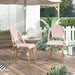 Pink and white chevron patterned chairs under an umbrella in a boho patio.