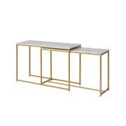 Left-angled faux white marble nesting tables with gold-tone frames on a white background.